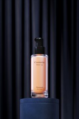 Foundation cosmetic bottle on blue leather podium and dark curtain backdrop. 3D illustration