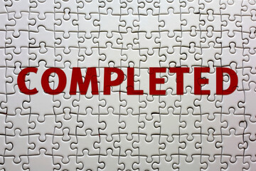 Fototapeta premium Jigsaw Puzzle with the word red COMPLETED.