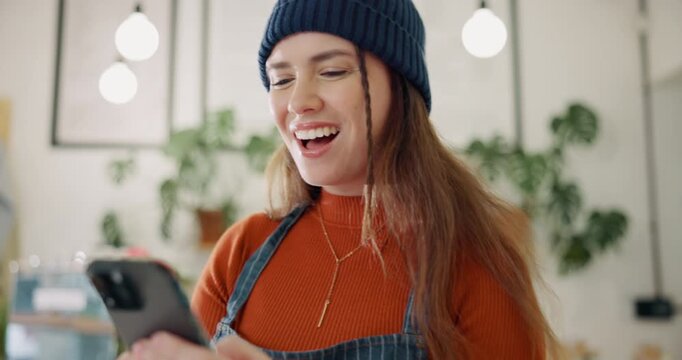 Woman, phone and celebration for success in cafe with promotion email, restaurant sales and excited. Business, employee and fist victory for online customer review, coffee shop profit and work target