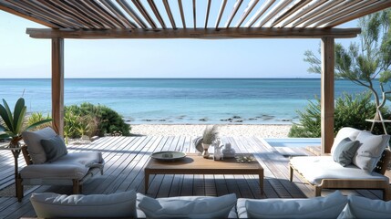 Obraz premium Serene and Sophisticated Modern Beachfront Property Setup with Wooden Table and Chairs under a Pergola, Overlooking Vibrant Azure Sea and Sandy Beach