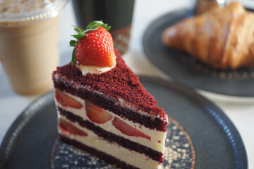 cutting Strawberry chiffon cake on a plate 