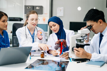 Medical, meeting and doctors with laptop for research, planning and hospital schedule management. Health, professional and people team for brainstorming in hospital