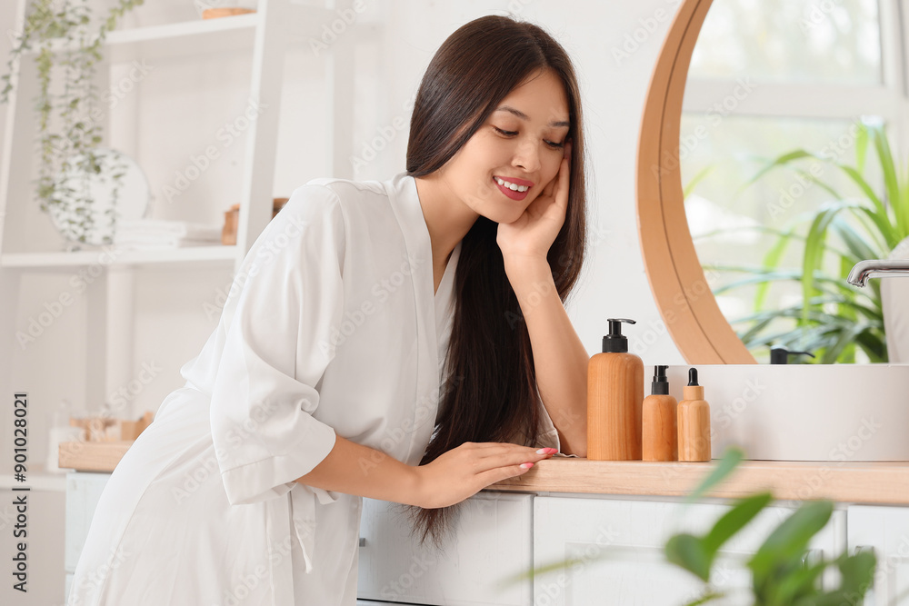 Sticker young asian woman with hair products in bathroom