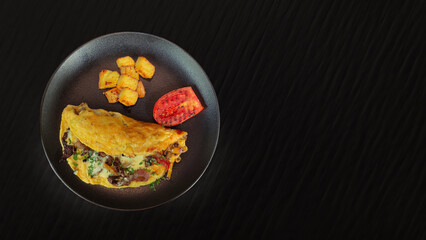 Breakfast with grilled meat, eggs with vegetables 