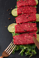 Raw meat and salt lime for roasting on a cutting board