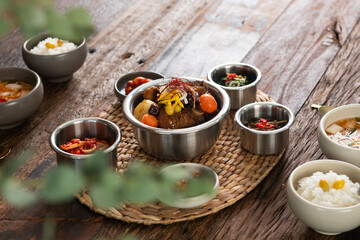 rib and various side dishes on the table