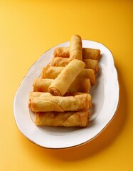 Turkish deep fried cigar shaped spring rolls, sigara borek on yellow background