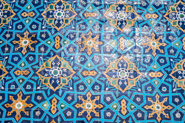 vintage ceramic tile with traditional Uzbek ornament Arabic Islamic pattern on wall of the ancient Muslim mosque Hazrati Imam in Uzbekistan
