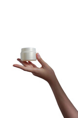 Female hand holds cream jar for cosmetics. Packaging for cream, gel, serum, advertising and product promotion, mock up           
