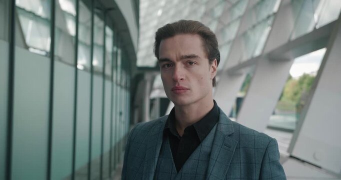 Dressed impeccably man's steadfastness gaze meets camera His steadfastness focus testament to his inner fortitude. In his steadfastness look there lies story of resilience and certainty.