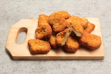 Chicken nuggets on a cutting board