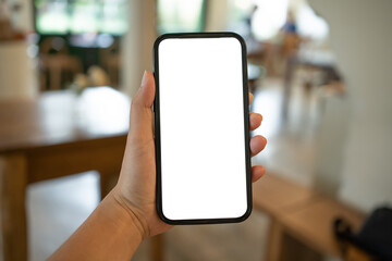 Cropped shot view of Women's hands holding cell telephone blank copy space screen. smart phone with technology concept