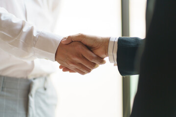 Businessman shaking hands successful making a deal. mans handshake. Business partnership meeting concept