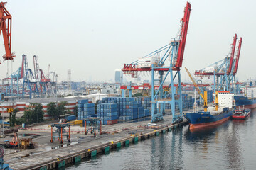 Container Ship Docked In The Port For Loading And Unloading Containers