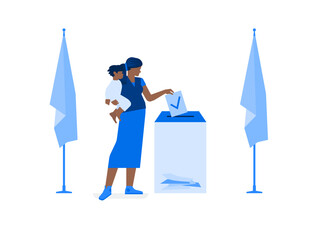 Mother with a baby in her arms votes at a polling station