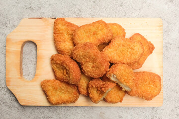 Chicken nuggets on a cutting board