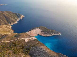  Navagio Beach, Zakynthos Island. Drone aerial view of famous Shipwreck Beach at sunset, Greece.