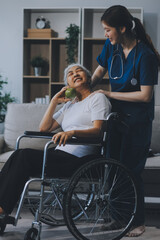 Asian physiotherapist helping elderly woman patient stretching arm during exercise correct with dumbbell in hand during training hand with patient Back problems in garden. Nursing home hospital