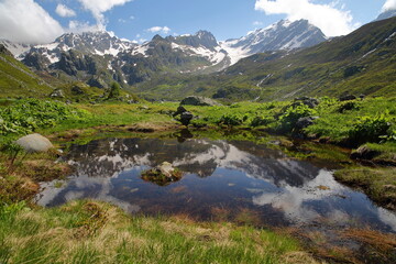 The valley of the petite Sassiere, Sainte Foy Tarentaise, Northern French Alps, Savoie, France, with the hamlet Sassiere and reflection of mountains (Invernet peak and Becca du Lac) © Christophe Cappelli