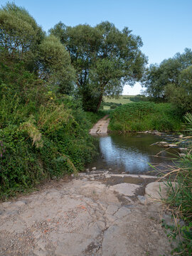 Crossing the low flow of the river Topla near the village of Lužany near Topla.