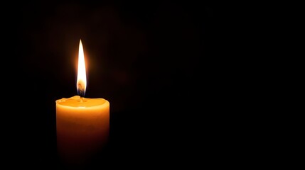A single candle burning in the dark, with wax dripping down the side.