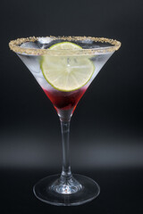 Alcoholic cocktail in a martini glass.