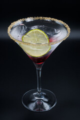 Alcoholic cocktail in a martini glass.