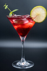 Alcoholic cocktail in a martini glass.