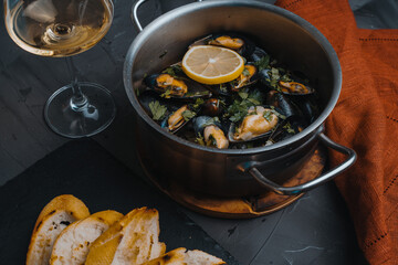 Mussels cooked according to a traditional Italian recipe in a sauce of white wine, garlic, lemon juice, shallots, butter and chopped parsley. Seasoned with salt and pepper.