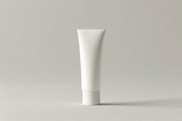 close up An empty white cosmetic tube standing, on an isolated plain background, shows natural skin care