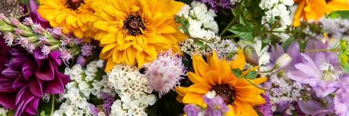Summer bouquet banner. Beautiful multi colored fresh flower arrangement. Locally sourced flowers birthday bouquet close up.