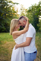a 30-year-old couple in love in the garden