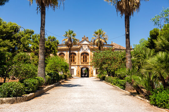 Villa Palagonia and beautiful garden. Italian Villa decorated with famous grotesques statues of monsters with human faces, Bagheria, near Palermo city. Sicily, Italy.