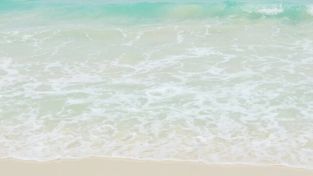 Tranquil turquoise waves softly washing ashore at redang island