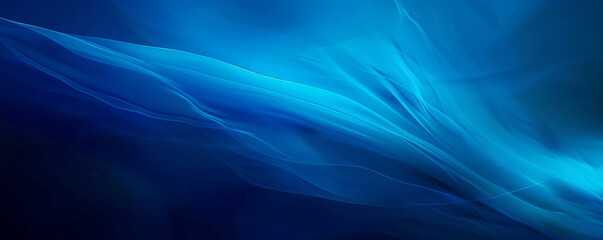 Fototapeta premium A striking blue background with a gradient that transitions from a dark blue at the top to a lighter blue at the bottom, adding a sense of movement and dynamism.