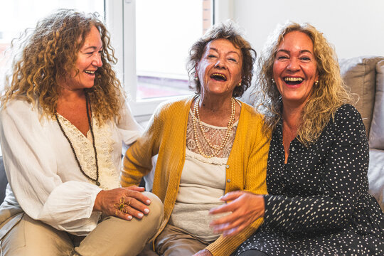 Mother and daughters enjoying leisure time at home