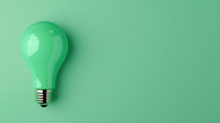 A creative and inspiring image of a green lightbulb, symbolizing ideas and innovation, set against a minimalist green background with space for text or graphics.