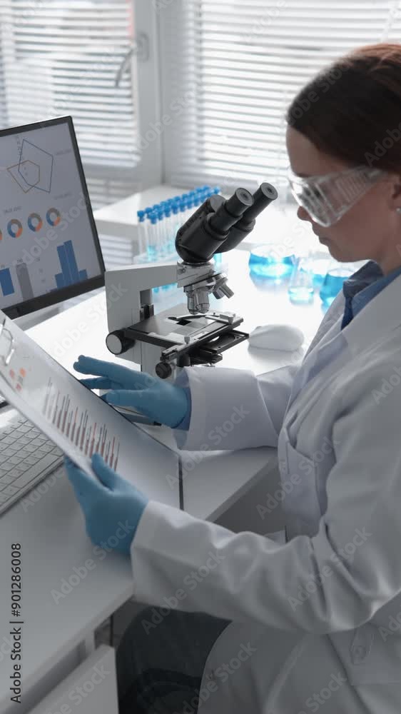 Aufkleber A female scientist in a stateoftheart lab uses a microscope advanced data tools, showcasing modernization in research. It illustrates progression in advanced research settings