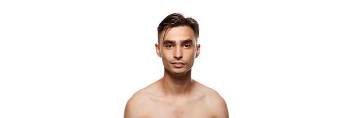 Banner. Confident young man looking at camera with smile against white studio background. Smooth...