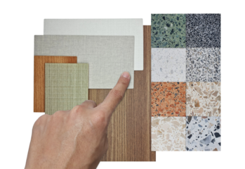 interior architect choosing material samples including multi color of terrazzo stones, oak wooden laminated, wooden veneer, fabric laminateds isolated on background with clipping path, top view.