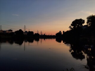 sunset over the water and lake