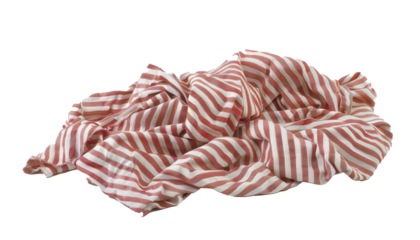 A crumpled red and white striped fabric lying on a plain surface, showcasing its soft and wrinkled texture.