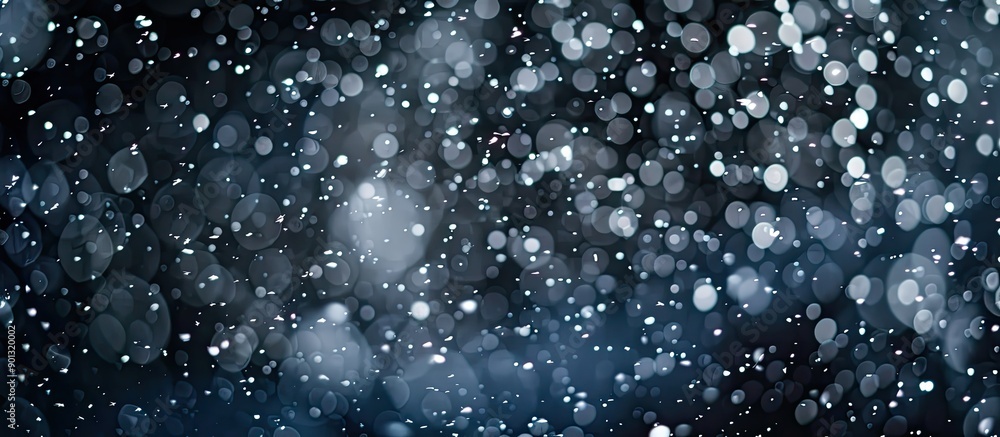 Aufkleber selective focus enhances the beauty of falling snow against a black background in this nature orient