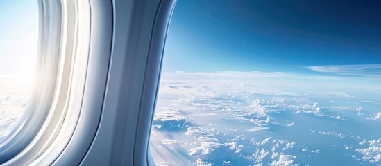 Naklejka premium View from an airplane window showing a blue sky with copy space image