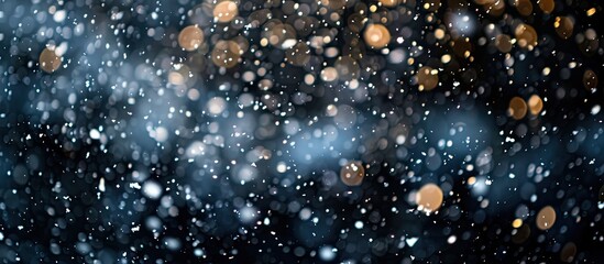 Selective focus enhances the beauty of falling snow against a black background in this nature oriented copy space image