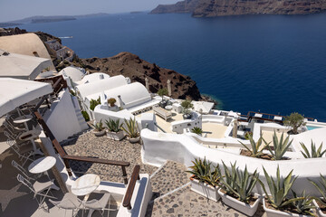   Whitewashed buildings on the edge of the caldera cliff, Oia village, Santorini, Greece