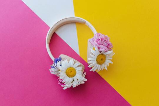 Headphones decorated with flower heads