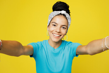 Close up smiling young Latin woman she wears blue top t-shirt headband casual clothes doing selfie...