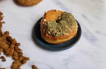 The donuts are topped with green tea sauce and caramel sauce which has a very delicious taste.