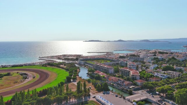 Marseille, France: Aerial view of famous French city by Mediterranean Sea, famous beaches Plages du Prado, summer day with clear blue sky - landscape panorama of Europe from above
